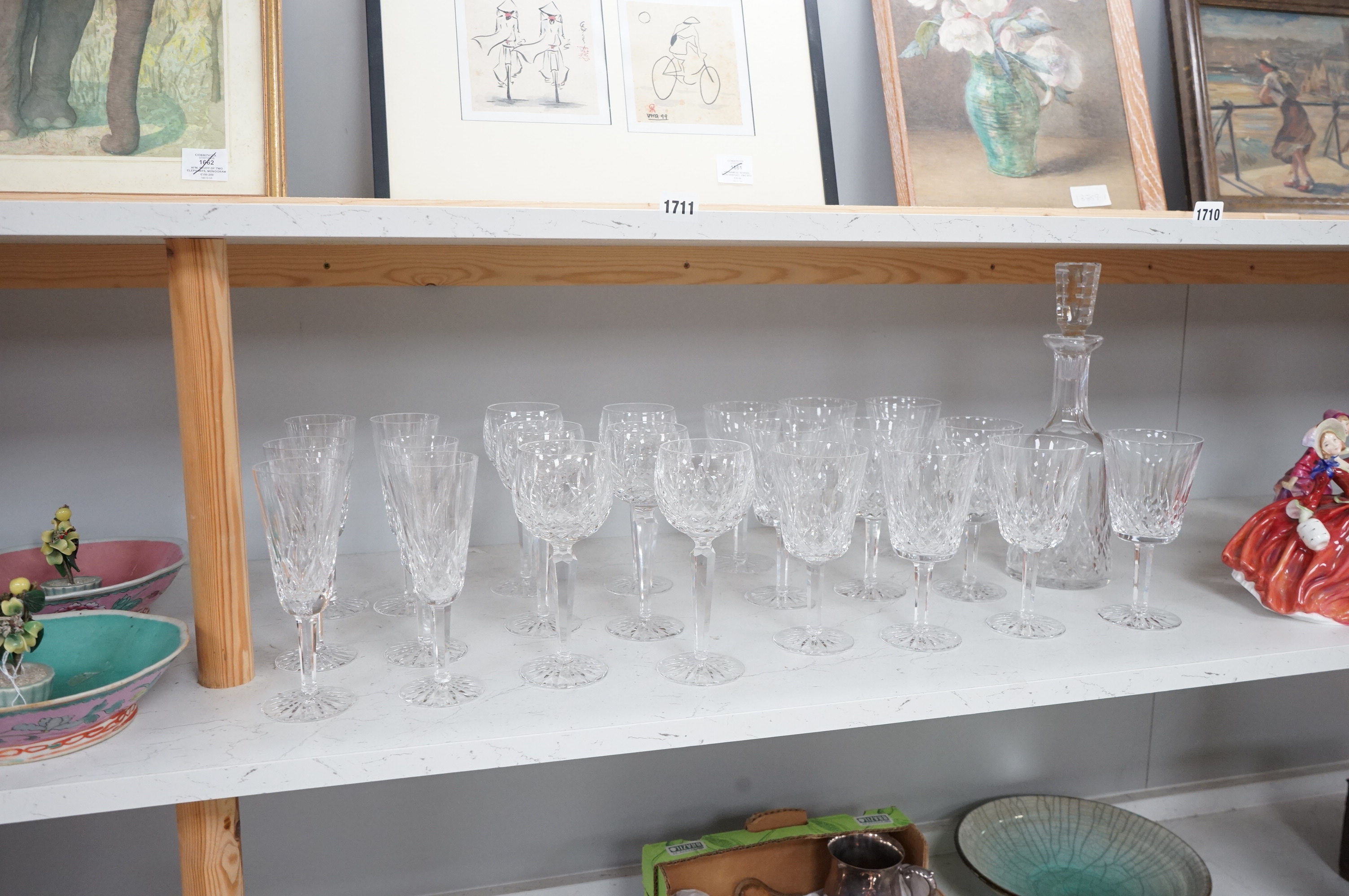 Twenty two Waterford Crystal company wine glasses and a decanter, 33cm